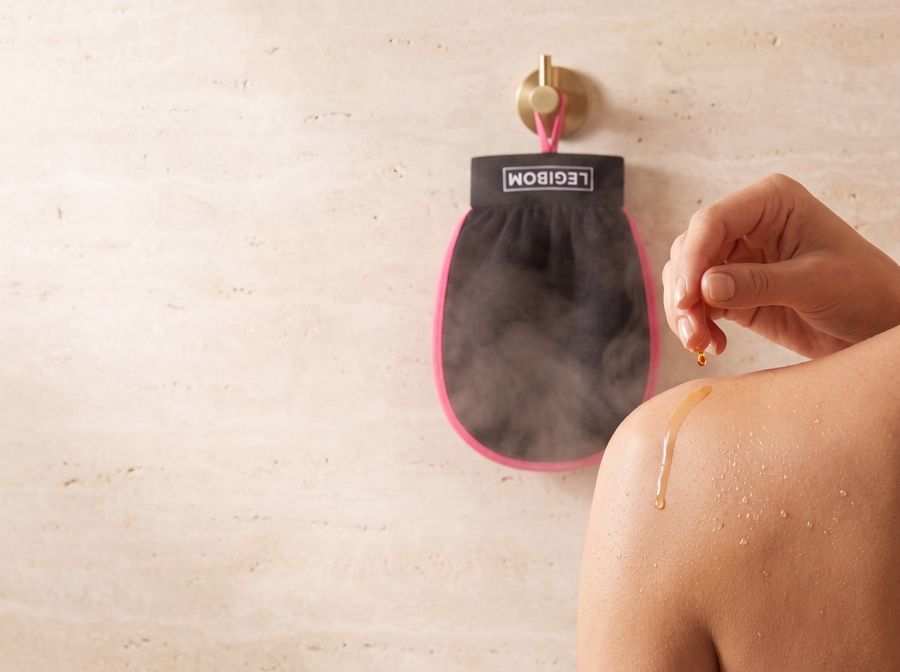 Body oil being applied to freshly exfoliated skin